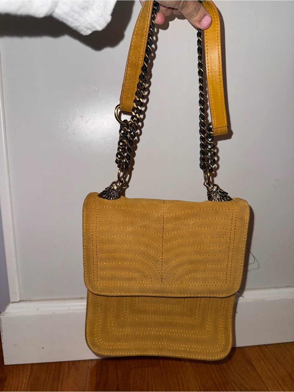 Mustard yellow Zara faux suede shoulder bag with distinct brass like wolf heads